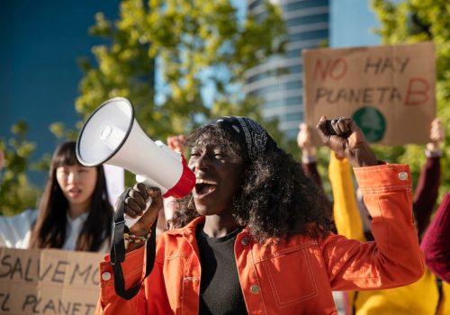 close-up-people-protesting-with-placards_23-2148970966
