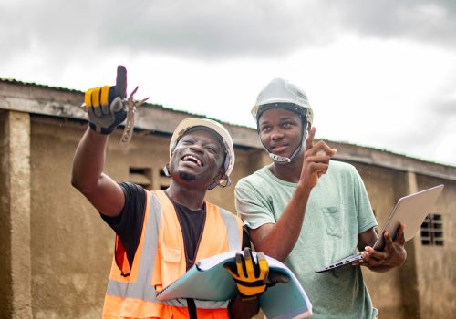 male-construction-workers-in-hard-hats-and-yellow-2025-02-02-14-17-29-utc
